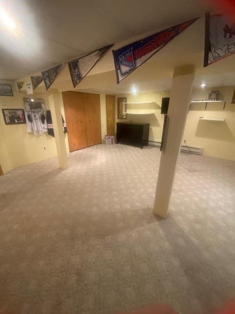 finished below grade area featuring carpet floors