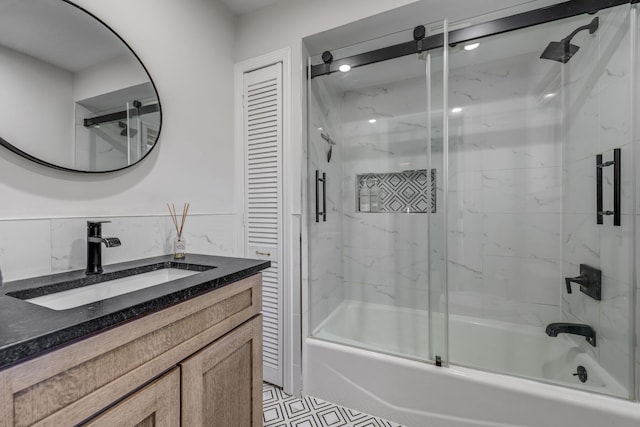 full bathroom featuring shower / bath combination with glass door and vanity