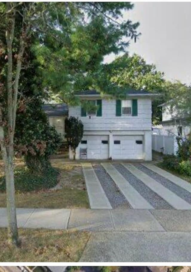 view of front of house featuring a garage and concrete driveway