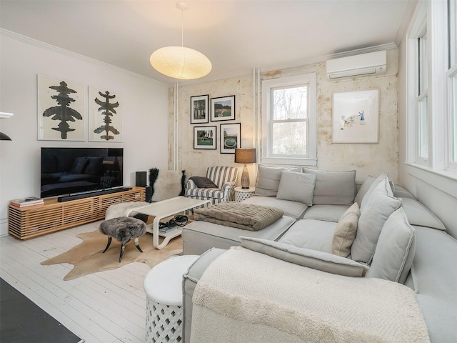 living room with hardwood / wood-style floors, ornamental molding, and a wall mounted AC