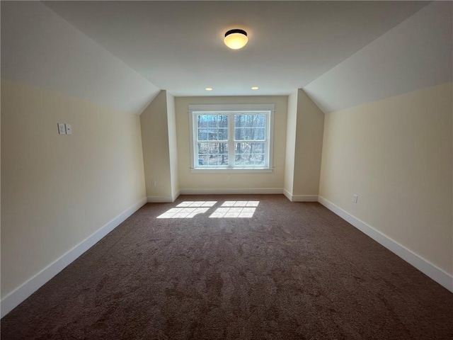 bonus room featuring vaulted ceiling, carpet, and baseboards