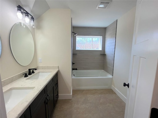 bathroom with double vanity, shower / bathtub combination, visible vents, a sink, and baseboards