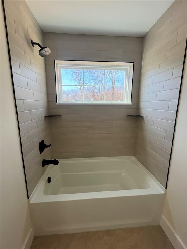 full bathroom with tile patterned flooring, tub / shower combination, and baseboards