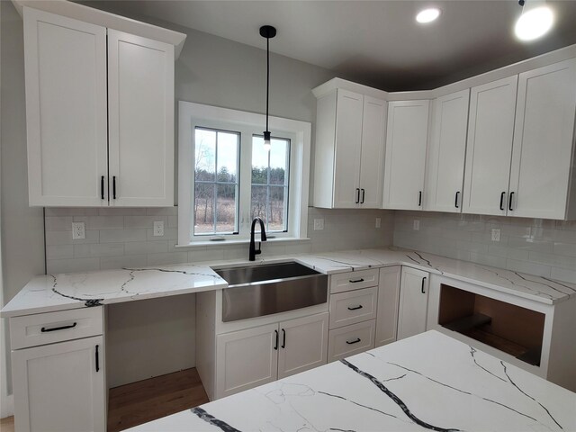 472 Wheeler Rd, Florida, NY 10921 - kitchen featuring a sink, backsplash, and light stone countertops