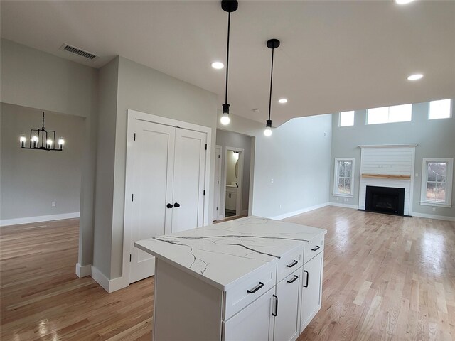 472 Wheeler Rd, Florida, NY 10921 - kitchen with baseboards, visible vents, light wood-style flooring, and an inviting chandelier