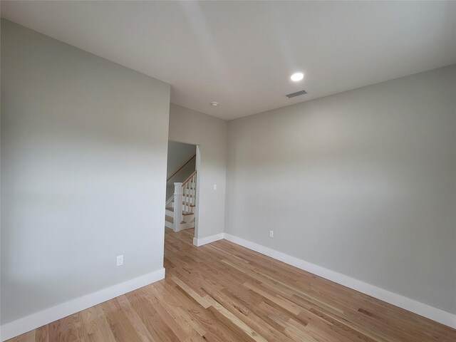 472 Wheeler Rd, Florida, NY 10921 - empty room featuring visible vents, baseboards, light wood-style floors, stairway, and recessed lighting