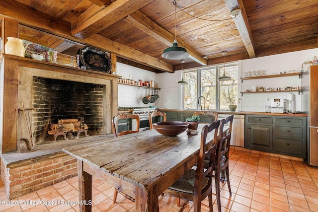 dining space featuring light tile patterned floors, beamed ceiling, and wooden ceiling