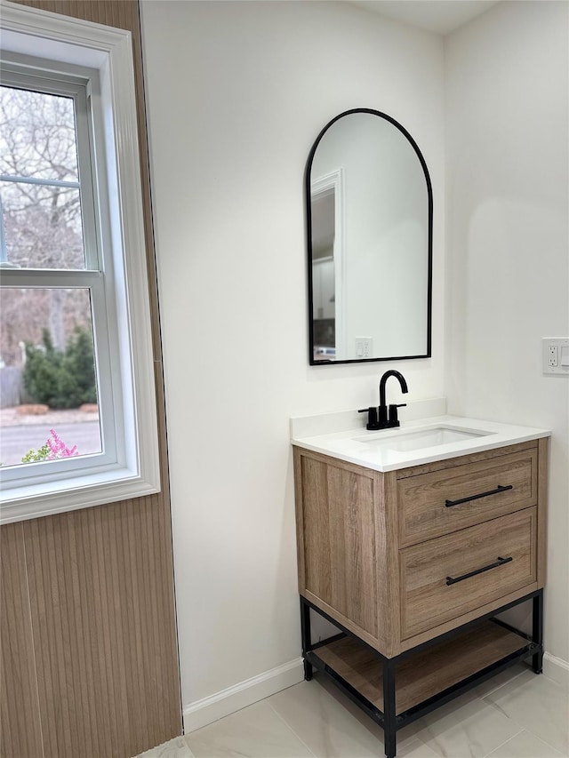 bathroom featuring vanity and baseboards