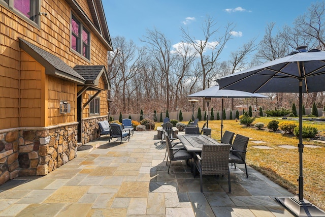 view of patio / terrace featuring outdoor dining space and fence