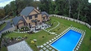 view of swimming pool with a fenced in pool, a yard, and fence