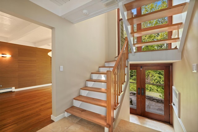 25 Moseman Ave, Katonah, NY 10536 - staircase featuring beam ceiling, baseboards, a baseboard heating unit, and wood finished floors