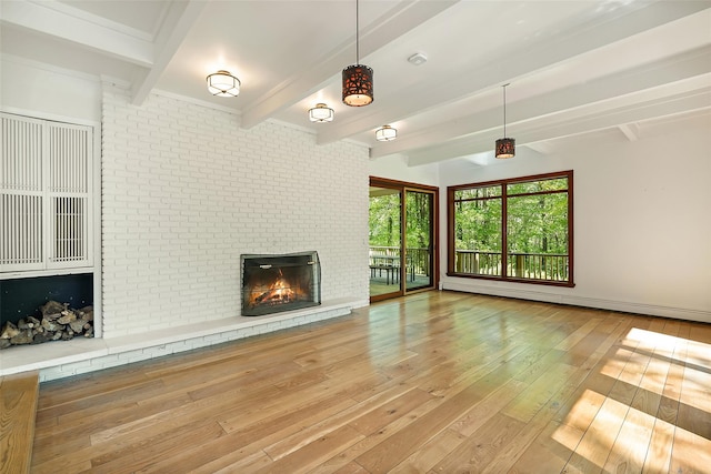 25 Moseman Ave, Katonah, NY 10536 - unfurnished living room with hardwood / wood-style floors, beamed ceiling, a fireplace, and baseboard heating