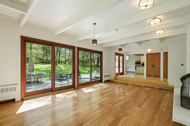 25 Moseman Ave, Katonah, NY 10536 - unfurnished living room with radiator heating unit, light wood finished floors, beam ceiling, and french doors