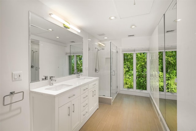 25 Moseman Ave, Katonah, NY 10536 - bathroom with plenty of natural light, a shower stall, double vanity, and recessed lighting