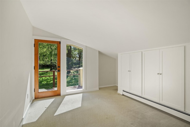 25 Moseman Ave, Katonah, NY 10536 - additional living space with a baseboard radiator, lofted ceiling, light colored carpet, and baseboards