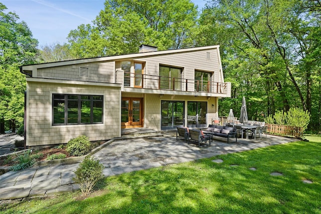 25 Moseman Ave, Katonah, NY 10536 - back of house featuring french doors, a balcony, a patio area, a lawn, and outdoor lounge area