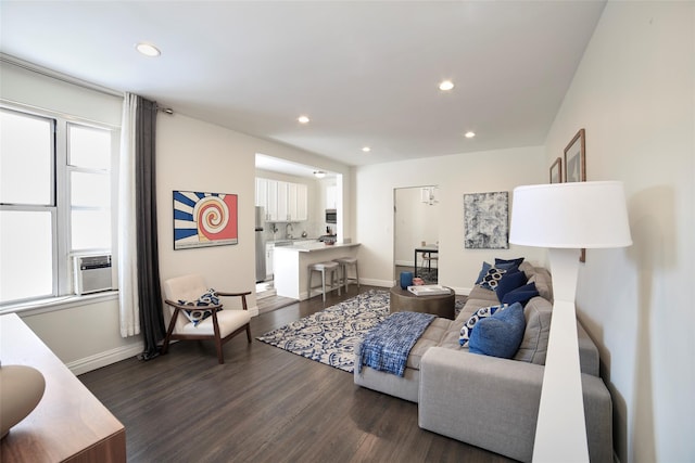 living room featuring baseboards, dark wood-style flooring, cooling unit, and recessed lighting