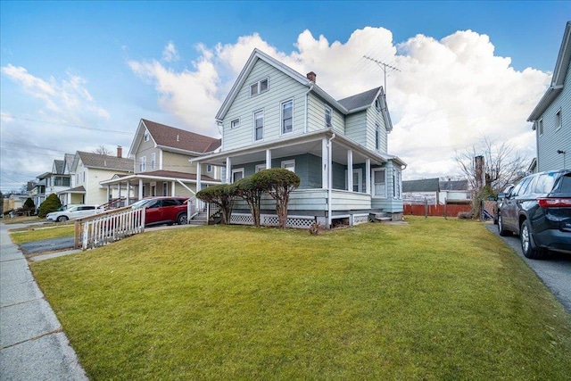 view of front of home featuring a porch and a front yard