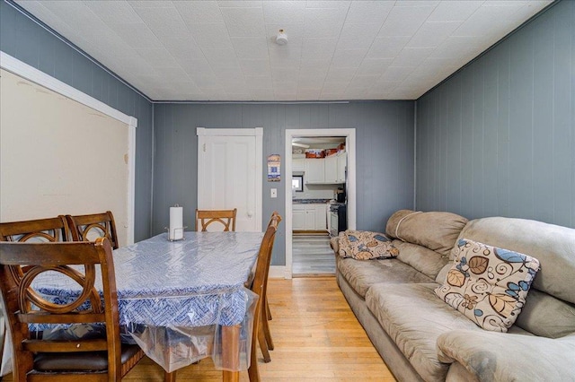 dining room with light wood-style floors