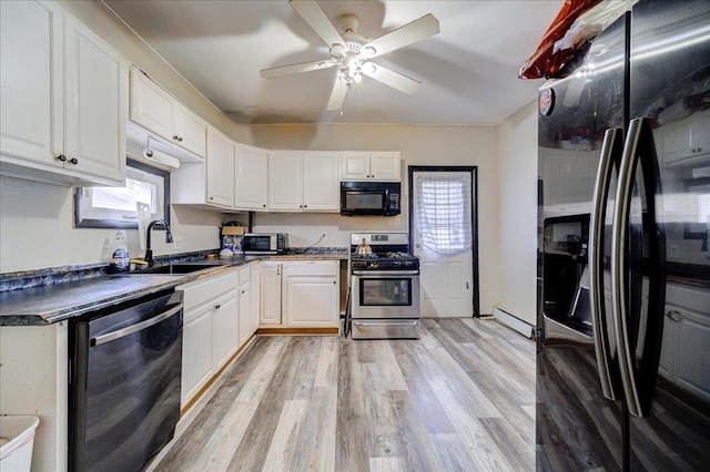 kitchen with fridge with ice dispenser, stainless steel gas stove, dark countertops, black microwave, and dishwashing machine