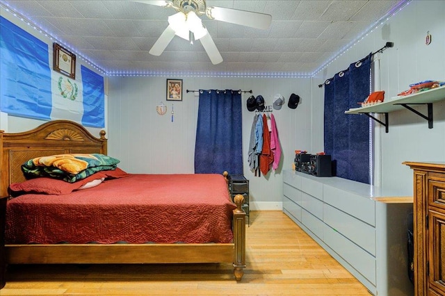 bedroom with wood finished floors and a ceiling fan