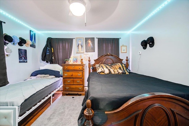 bedroom with a ceiling fan and wood finished floors