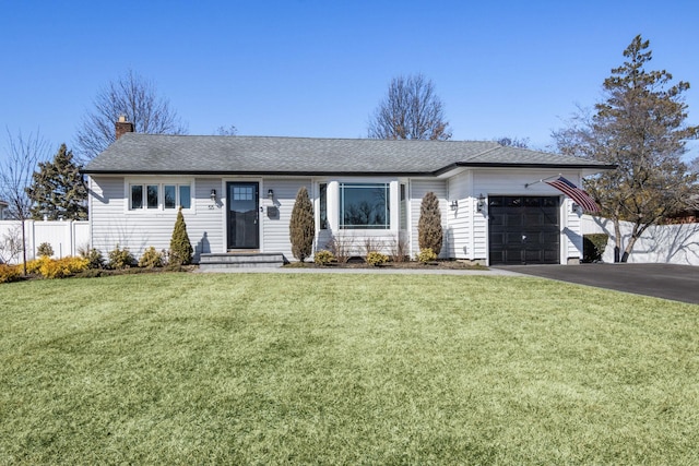 ranch-style home with a front lawn, driveway, fence, a garage, and a chimney