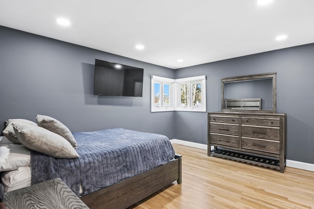 bedroom featuring recessed lighting, baseboards, and wood finished floors