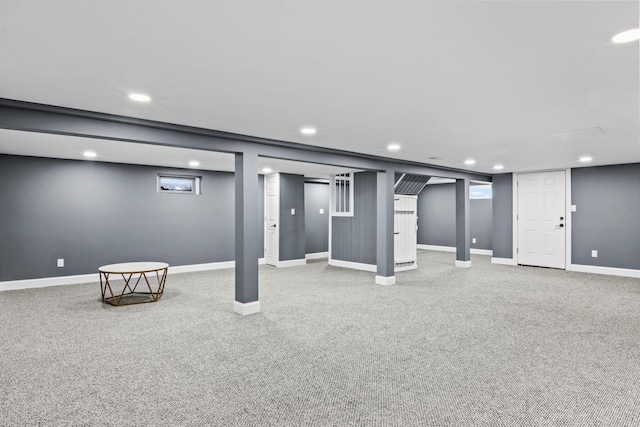 finished basement featuring recessed lighting, baseboards, and carpet