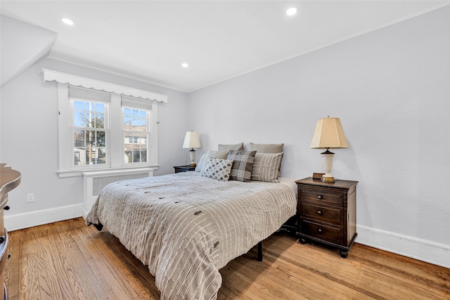 bedroom featuring lofted ceiling, recessed lighting, baseboards, and wood-type flooring