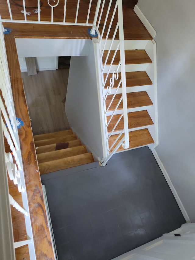 stairs featuring baseboards