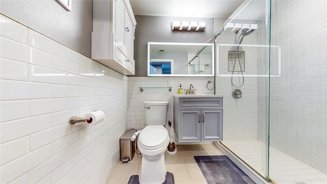 bathroom featuring tile walls, tile patterned flooring, a shower stall, and toilet