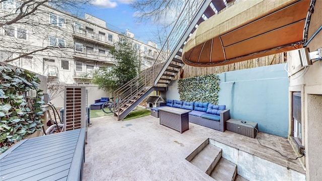 view of patio / terrace with stairway and an outdoor living space