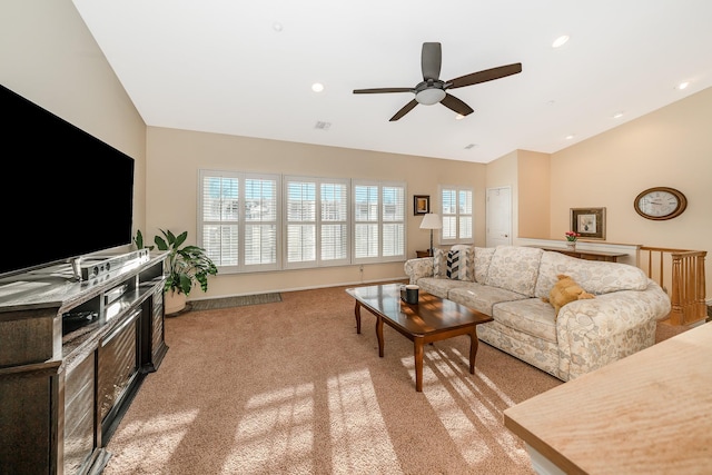 living room featuring baseboards, vaulted ceiling, light carpet, recessed lighting, and a ceiling fan