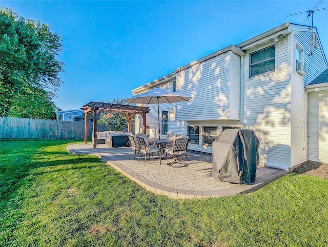 back of property featuring a patio, a lawn, fence, and a pergola