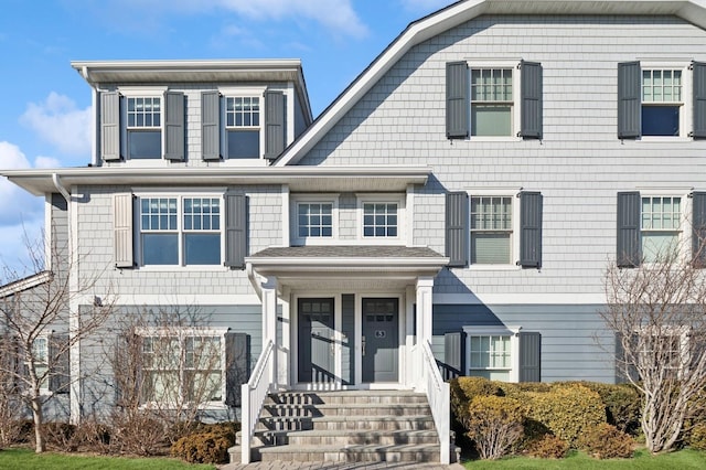 view of front of home with a gambrel roof