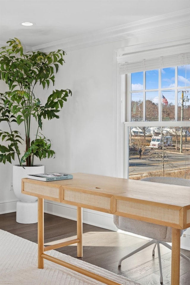 interior details with baseboards, wood finished floors, and crown molding