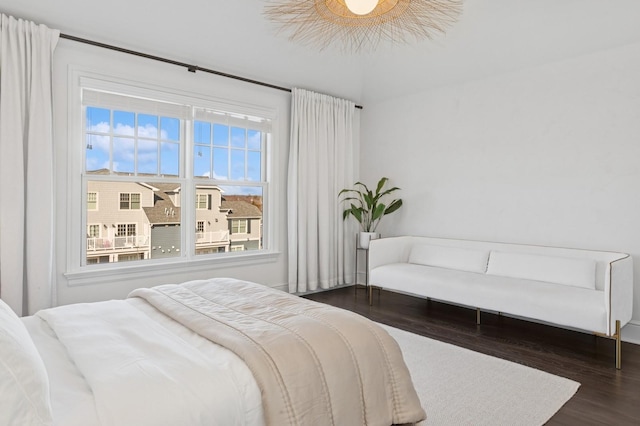 bedroom with dark wood-style floors