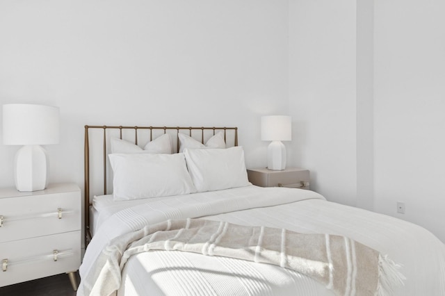 bedroom featuring wood finished floors