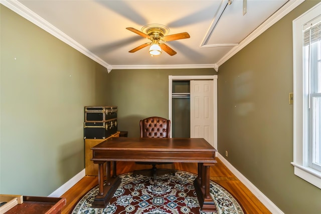 home office with baseboards, crown molding, and wood finished floors