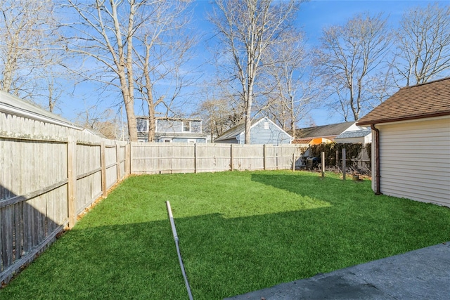 view of yard featuring a fenced backyard