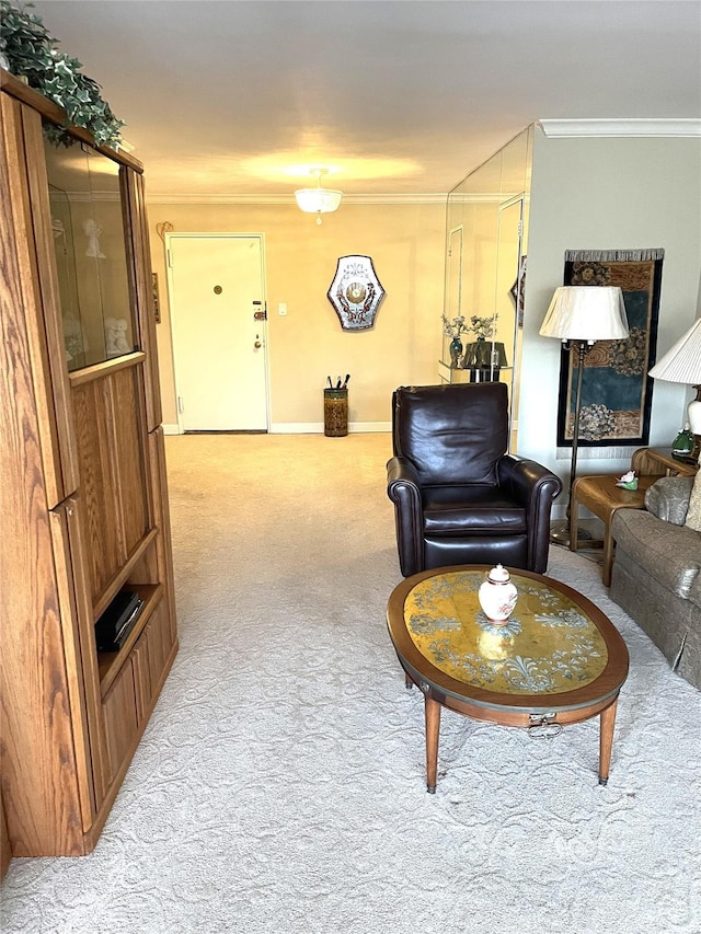 living area featuring baseboards, crown molding, and light colored carpet