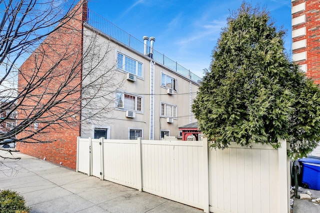 exterior space with fence and stucco siding