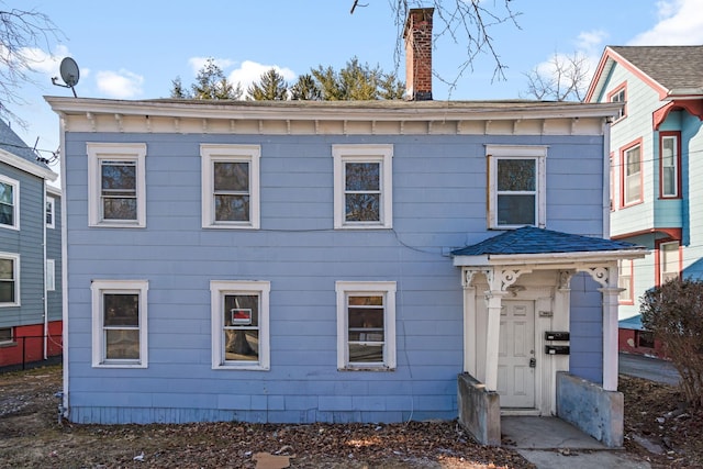 view of front of house with a chimney