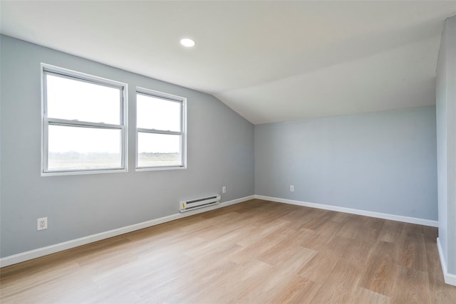 bonus room featuring lofted ceiling, a baseboard radiator, recessed lighting, baseboards, and light wood-type flooring