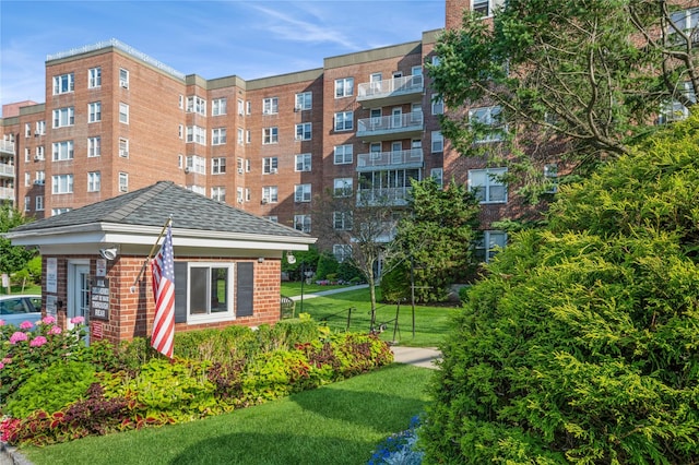 view of property's community with a yard