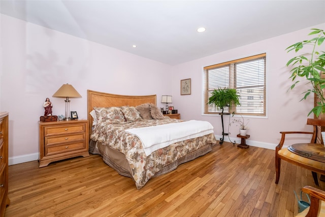 bedroom featuring recessed lighting, baseboards, and light wood-style floors