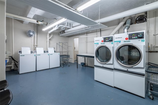 common laundry area with independent washer and dryer