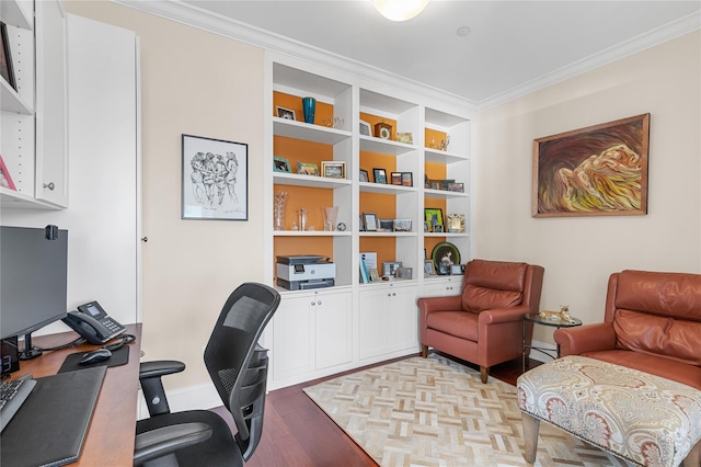 home office with built in features, baseboards, crown molding, and parquet flooring