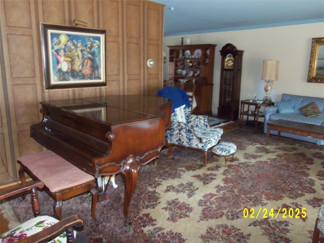 living area featuring carpet floors and ornamental molding